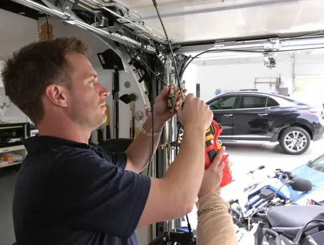 Brea Garage Door Repair safety certified technician performing cable replacement in Brea